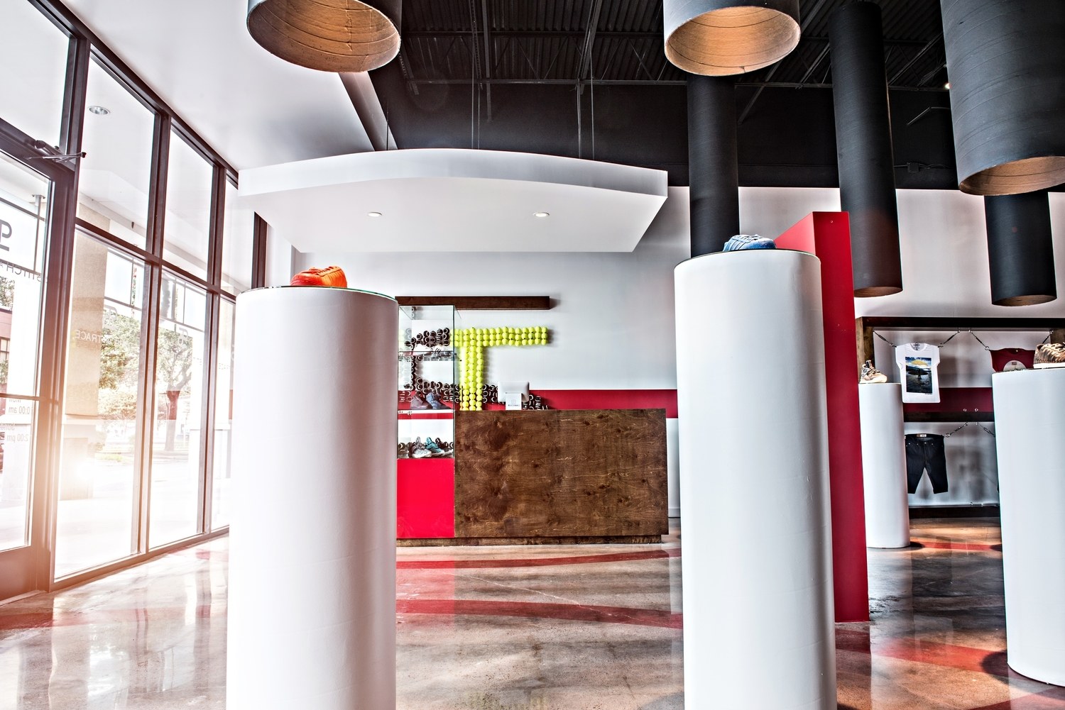 Light-filled retail entry with cylindrical product displays