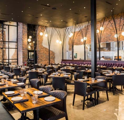 Warmly lit restaurant dining room